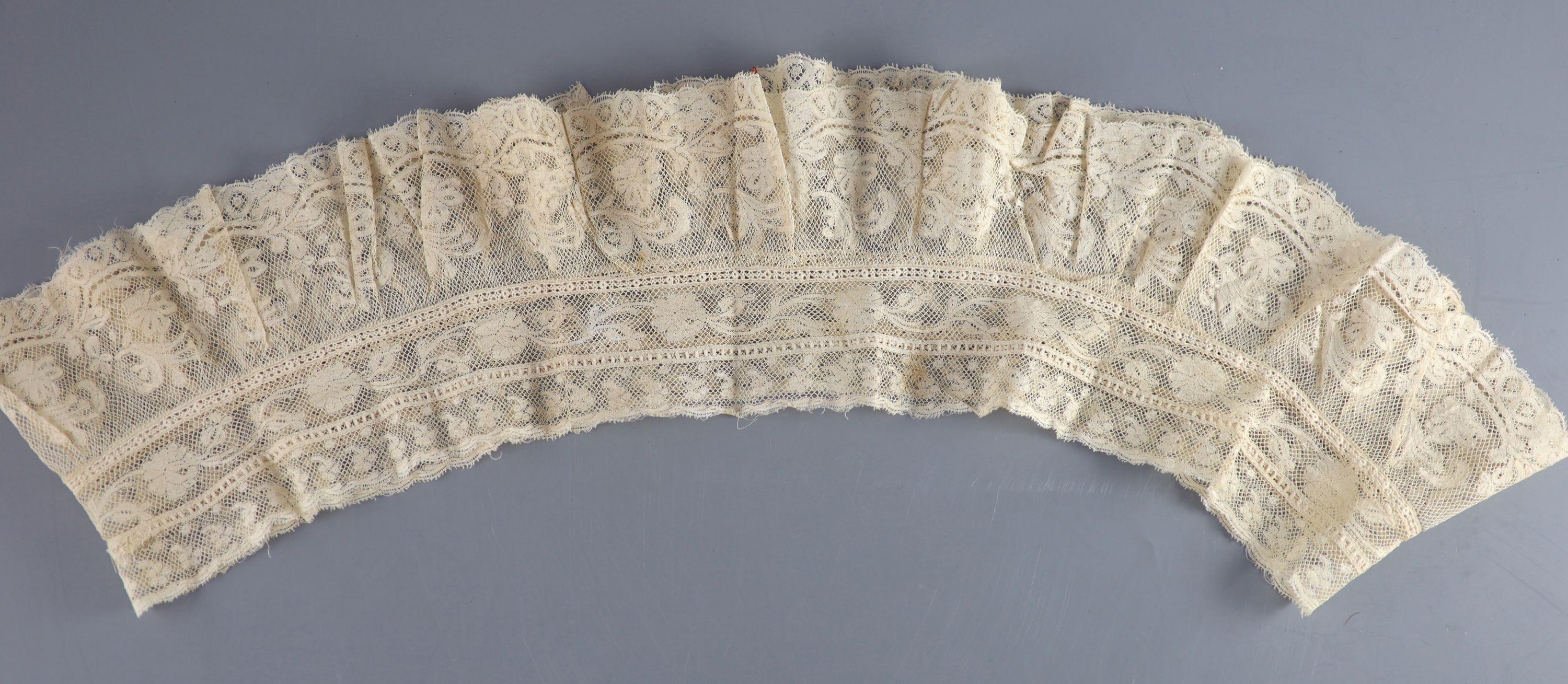 A 19th century needle-run bonnet veil, a French lace ruffed bobbin collar and two filet panels